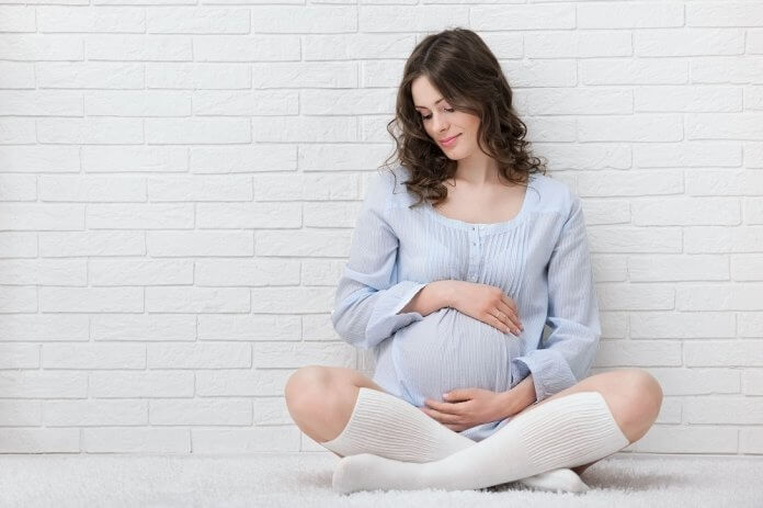 Portrait of the young pregnant woman